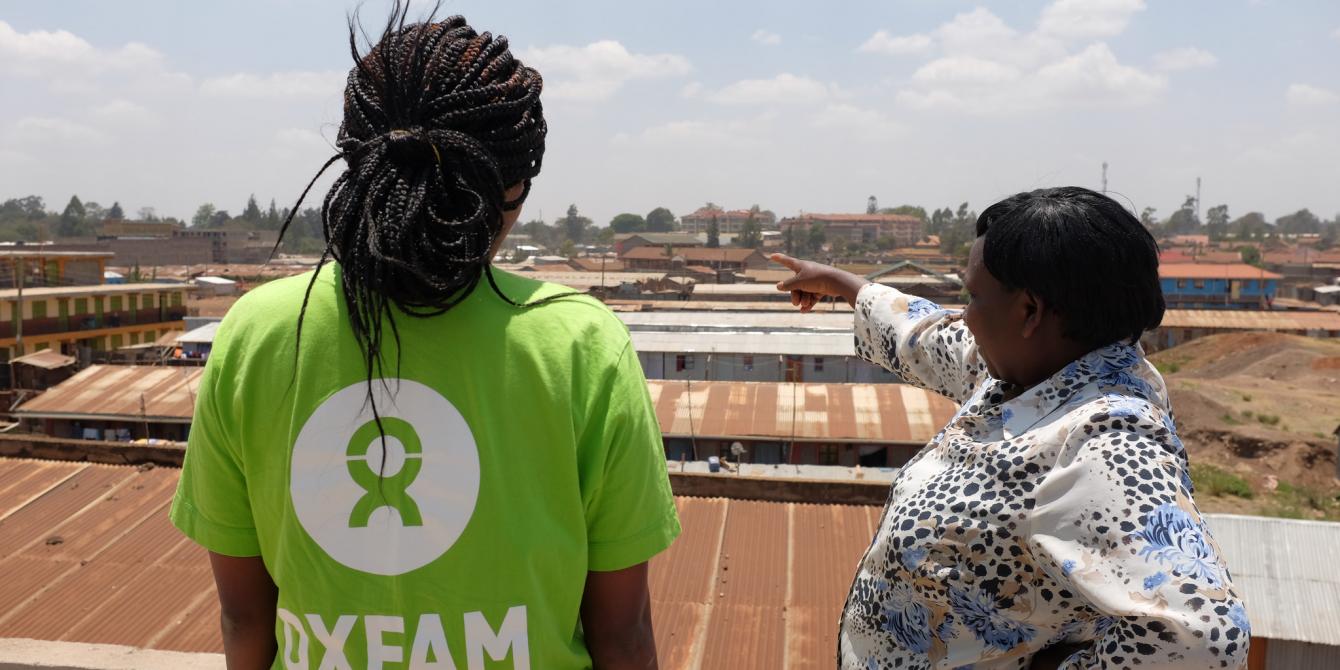 Jane Muthoni describing her local area and pointing out poor public services in the community. Kawangware, Nairobi, Kenya. Photo Credit: Allan Gichigo Jane Muthoni describing her local area and pointing out poor public services in the community. Kawangware, Nairobi, Kenya. Photo Credit: Allan Gichigi